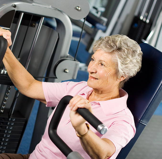 Older woman in the weight room at a gym
